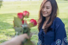 https://thumbs.dreamstime.com/t/man-giving-red-rose-flowers-to-asian-girlfriend-valentine-s-day-man-giving-red-rose-flowers-to-asian-girlfriend-103781020.jpg