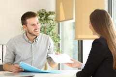 Man giving resume in a job interview royalty free stock photography Man giving resume in a job interview royalty free stock photography