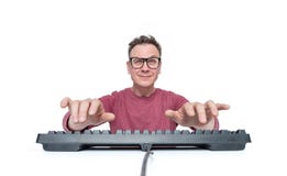 Man in glasses and a red T-shirt is typing on the keyboard, a look into the camera, isolated on white background. Front view. stock photography Man in glasses and a red T-shirt is typing on the keyboard, a look into the camera, isolated on white background. Front view. stock photography