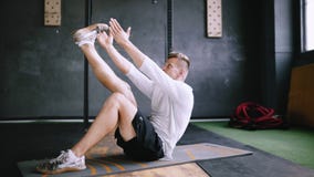 Intermediate no equipmetn exersize to endurance, sit ups. stock video Intermediate no equipmetn exersize to endurance, sit ups. stock video
