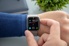 Man hand with Apple Watch Series 4 over the table stock photo Man hand with Apple Watch Series 4 over the table stock photo