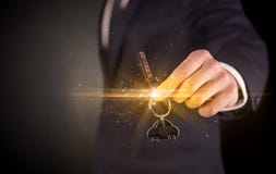 Man hand over keys stock photos Man hand over keys stock photos