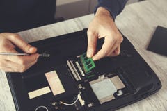 Man hand tools with broken notebook stock image Man hand tools with broken notebook stock image