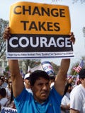 Man Holding Protest Sign
