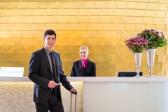 Hotel receptionist check in man giving key card stock photos Hotel receptionist check in man giving key card stock photos
