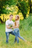 Man hugging his girl standing back to the camera stock photos Man hugging his girl standing back to the camera stock photos