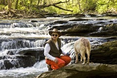 Man In River With Dog Royalty Free Stock Images