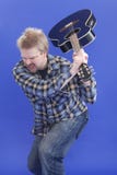 Man Is Smashing His Guitar On The Floor Royalty Free Stock Photos
