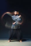 Man in kimono excercising Martial Arts