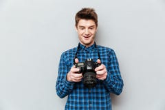 Man looking at images on camera and surprising royalty free stock image Man looking at images on camera and surprising royalty free stock image