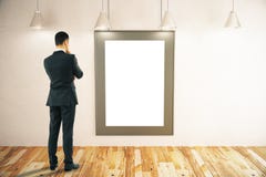 Man looking at picture frame Stock Photo Man looking at picture frame Stock Photo