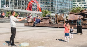 Man makes giant bubbles in the middle of a central square stock images Man makes giant bubbles in the middle of a central square stock images