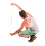 Man measures the wall stock image Man measures the wall stock image