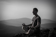 Man Meditation On A Rock Stock Images