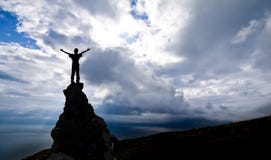 Man On The Top Of A Rock Stock Image