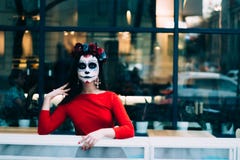 A man with a painted face of a skeleton, a dead zombie, in the city during the day. day of all souls, day of the dead, halloween, royalty free stock photography A man with a painted face of a skeleton, a dead zombie, in the city during the day. day of all souls, day of the dead, halloween, royalty free stock photography