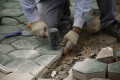 The man paving green concrete royalty free stock photography The man paving green concrete royalty free stock photography