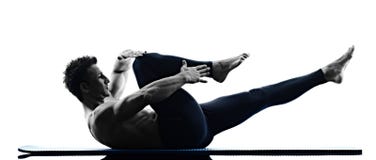 Add Pilates to Your Weightlifting Program - Man strengthening core