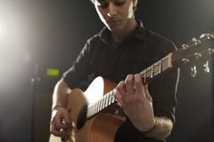 Man Playing Acoustic Guitar In Studio Royalty Free Stock Photography Man Playing Acoustic Guitar In Studio Royalty Free Stock Photography