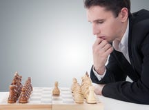 Man Playing Chess, Making The Move Stock Photography