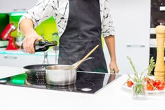 Man pouring in the pan royalty free stock images Man pouring in the pan royalty free stock images