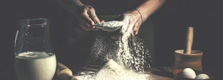 Man Preparing Bread Dough On Wooden Table In A Bakery Close Up. Preparation Of Easter Bread. Royalty Free Stock Photography Man Preparing Bread Dough On Wooden Table In A Bakery Close Up. Preparation Of Easter Bread. Royalty Free Stock Photography