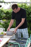 Man preparing plates royalty free stock photos Man preparing plates royalty free stock photos