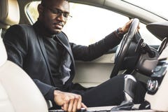The man presses the buttons in the car. Adjustment of audio volume control. stock photos The man presses the buttons in the car. Adjustment of audio volume control. stock photos