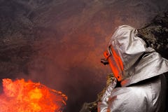 A man in a protective suit near the mouth of the volcano. Investigation of the volcano stock photos A man in a protective suit near the mouth of the volcano. Investigation of the volcano stock photos