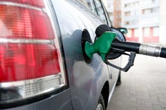 Man pumping gasoline into the car at the gas station-transportation concept royalty free stock image Man pumping gasoline into the car at the gas station-transportation concept royalty free stock image