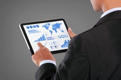 Man pushing on a touch screen tablet of infographics