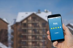 Man rating his experience with the stars on the screen of the smartphone app stock photos Man rating his experience with the stars on the screen of the smartphone app stock photos