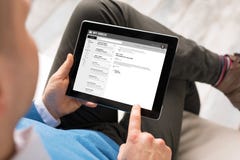 Man reading email on tablet royalty free stock photos Man reading email on tablet royalty free stock photos