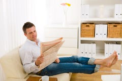 Man Reading Newspaper On Couch Royalty Free Stock Photo Man Reading Newspaper On Couch Royalty Free Stock Photo