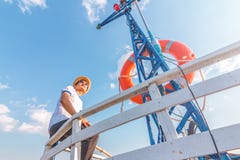 A man relaxing happily on the vacation sailboat yacht having a rest on summer boat and blue sky background stock image A man relaxing happily on the vacation sailboat yacht having a rest on summer boat and blue sky background stock image
