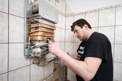 Man repairing gas furnace