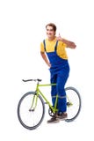 The man repairing his bike on white background royalty free stock image The man repairing his bike on white background royalty free stock image