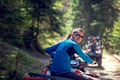 Man riding atv vehicle on off road track ,people outdoor sport activitiies theme stock photography Man riding atv vehicle on off road track ,people outdoor sport activitiies theme stock photography