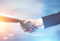 Man and robot handshake, blurred stock image Man and robot handshake, blurred stock image