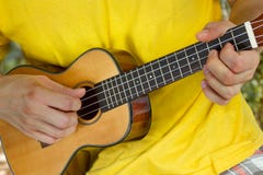 Free Man S Hands Playing Ukulele Stock Photos - 54274723