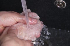 Man S Hands Washing And Cleaning Chicken Wings At The