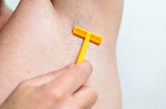 Man shaving under his armpit royalty free stock photos Man shaving under his armpit royalty free stock photos