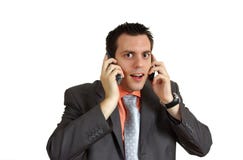 Man Shocked With Two Telephones Stock Photography