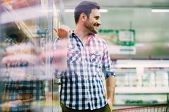 Man shopping in supermarket stock photo Man shopping in supermarket stock photo