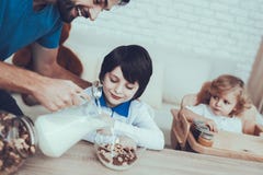 Father is Feeding His Sons a Breakfast royalty free stock image Father is Feeding His Sons a Breakfast royalty free stock image