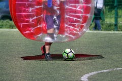 Man on a sports field playing in the bumper ball Stock Images Man on a sports field playing in the bumper ball Stock Images