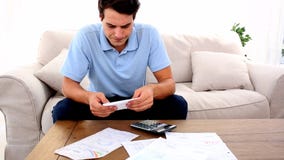Man stressed with so many bills to pay