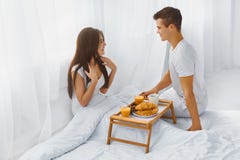 https://thumbs.dreamstime.com/t/man-surprising-woman-breakfast-bed-handsome-smiling-men-his-attractive-happy-women-romantic-morning-relationships-care-61076172.jpg