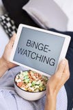 Man and tablet, with the text binge-watching in it royalty free stock image Man and tablet, with the text binge-watching in it royalty free stock image