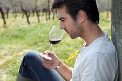 Man Tasting Wine In Field Royalty Free Stock Photo